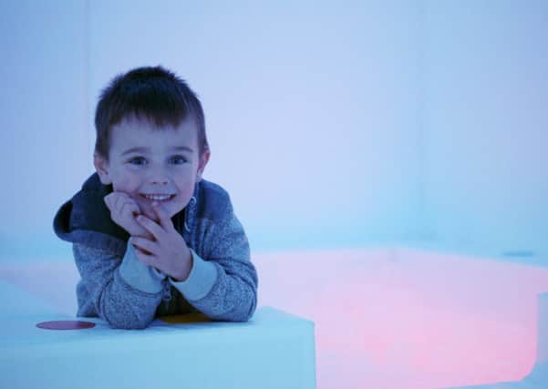 Decster Holmes, three, enjoys the new state-of-the-art sensory room