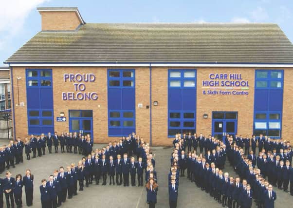 Pupils spell out the word Carr