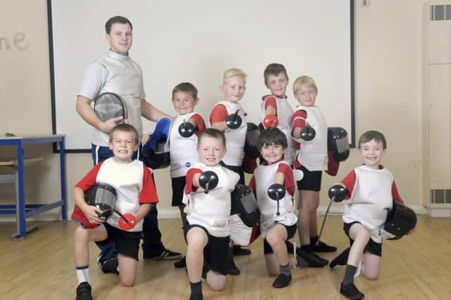 Children at Clifton Primary School take part in fencing lessons