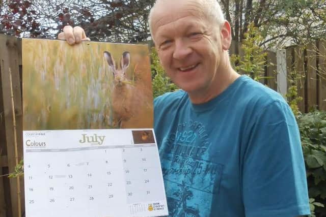 Andy Stewart with his  hare photo in the Countryfile calendar