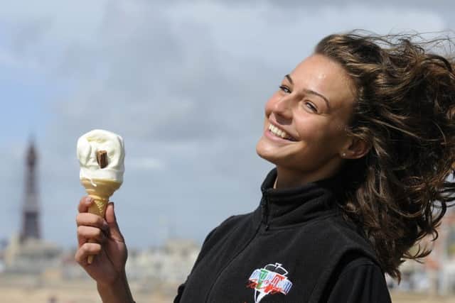 Windy but sunny weather on Blackpool Promenade.  Pictured is Maddie Vettese from Notarianni Ices.