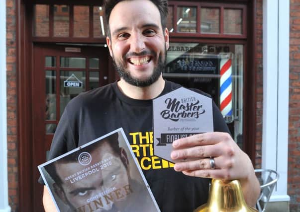 Award-winning Garstang barber Joe Cartmel outside one of his barber shops after scooping three awards this year