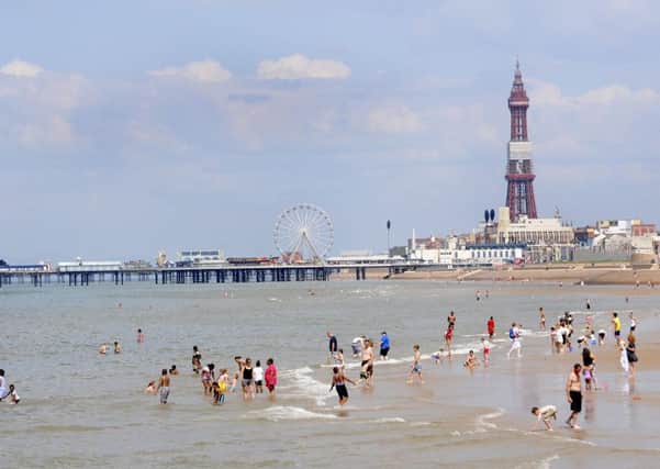 Holidaymakers enjoy the hot and sunny weather on Blackpool beach