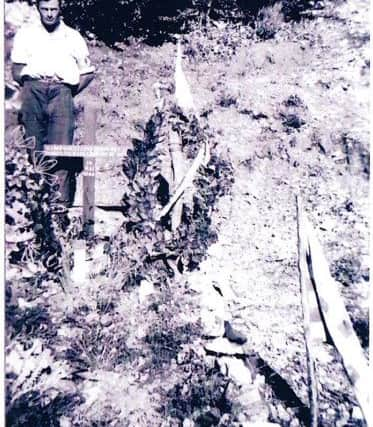 The original collective grave - the cross was replaced by a memorial of local stone in 1945