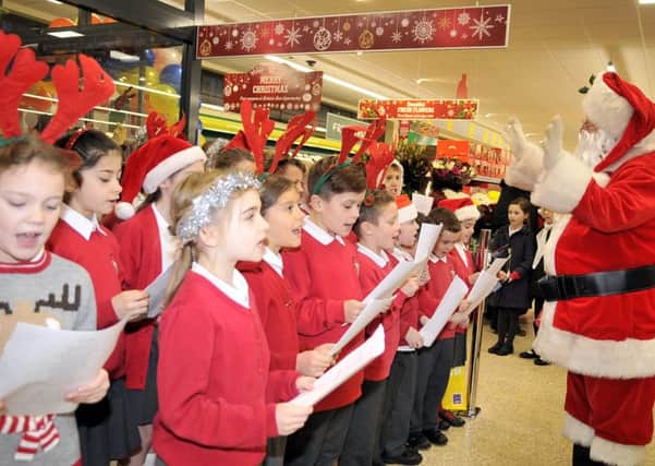 Garstang Community Primary School Choir performing at the new Aldi Store in Garstang