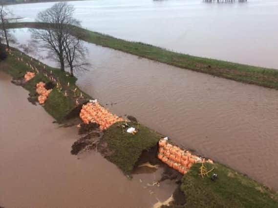 Sandbags were used to patch up the damage to the flood defences in St Michaels
