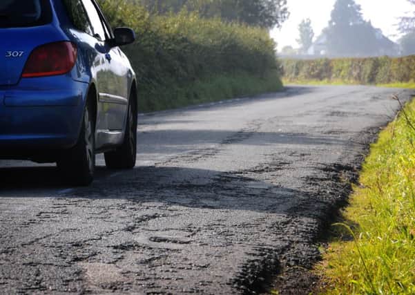 Potholes: A damaged road
