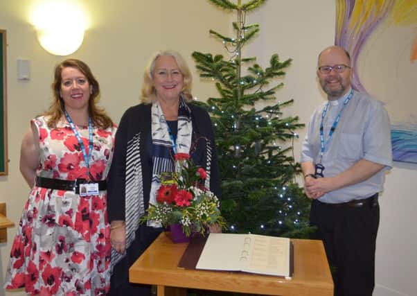 Head of fund-raising and voluntary services Caroline Scholz,  fund-raising administrator Hazel Preston and Rev Graeme Harrison with the  Book of Remembrance in the Chapel at Blackpool Victoria Hospital