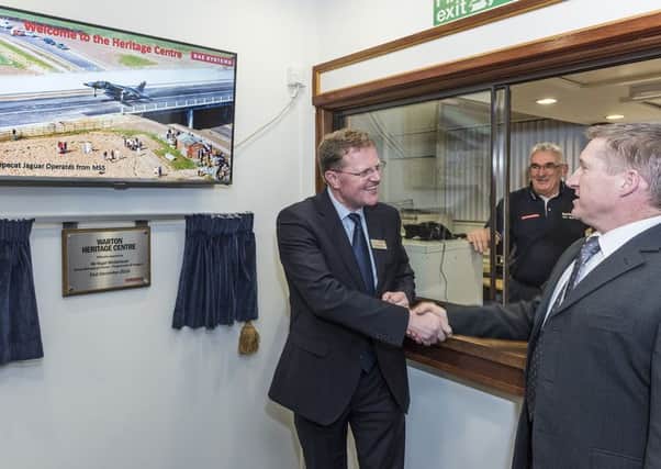 Nigel Whitehead, group managing director for Programmes and Support at BAE Systems, opens the heritage centre in Warton with heritage centre manager Ian Lawrenson, right