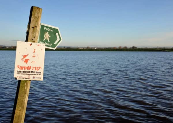 The Lancashire village of St Michaels and surrounding area was again affected by flooding following Boxing Day's record-breaking rainfall. A public footpath sign points across a newly-formed lake.