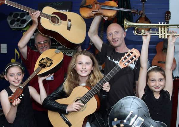 John Shaw (top left) with youngsters at the launch of the Give Us A Tune campaign
