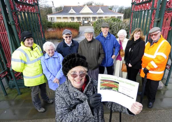 Barbara Pagett (front) with fellow Supporters of Ashton Gardens with Barbara Pagett and the centenary calendar