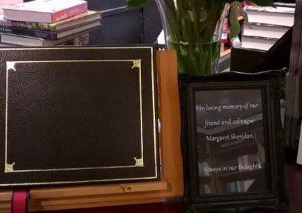 A book of condolences and memorial plaque are on display at Waterstones, on Bank Hey Street, in tribute to Margaret Sheridan who was killed by a falling sign as she locked up at the store on January 12, 2015.
