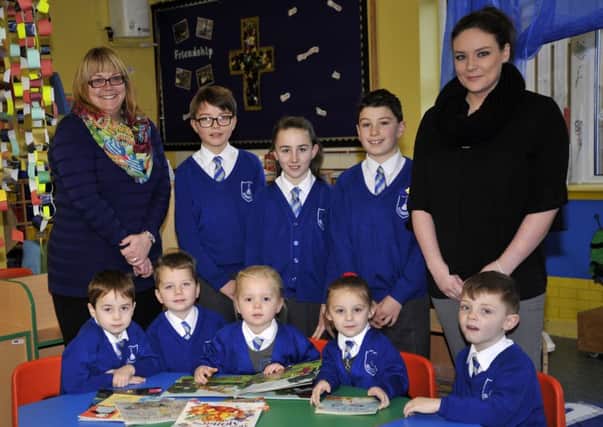 back from left, Gillian Crossley, Jorge, Charlotte, Ben and Emma Hopwood, front from left, Kian, Michael, Amelie, Amy and George from St Chad's School in Poulton where all pupils reached Maths, Reading and Writing standards