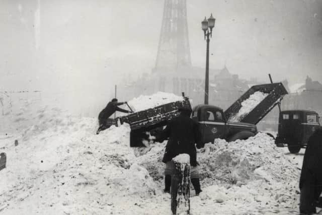 Snowdune on the Promenade in 1947. Workmen dump snow cleared from Fylde coast roads on the Blackpool beach