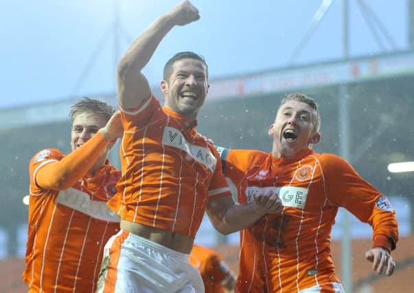 David Norris celebrates scoring Blackpool's fourth