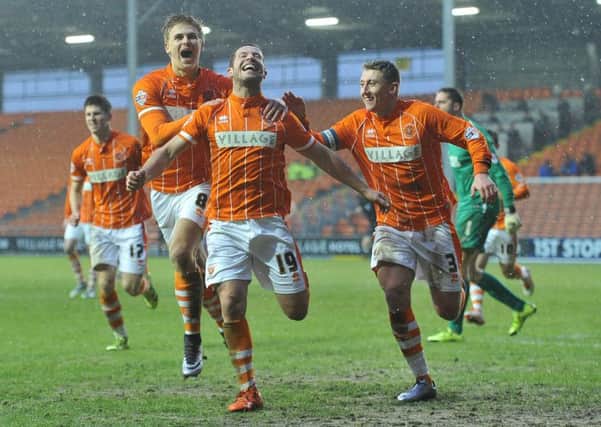 Blackpool's David Norris celebrates firing Blackpool's fourth