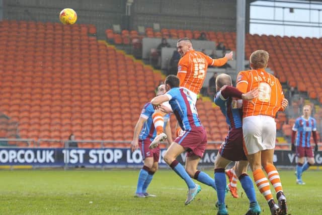 Blackpool's Tom Aldred heads in his team's first goal