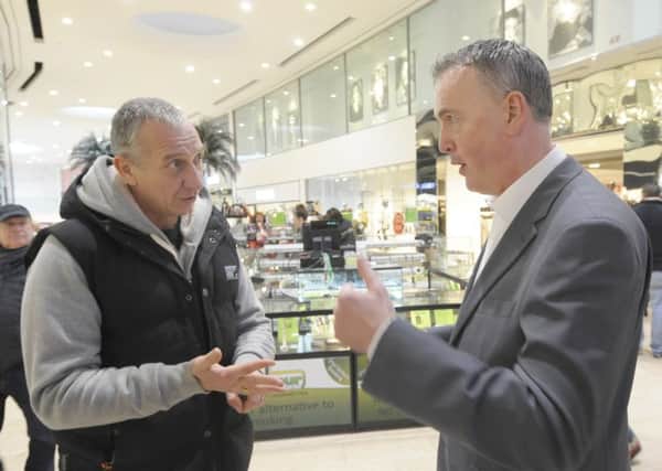 Lancashire PCC Clive Grunshaw talk to shoppers in the Houndshill.  He is pictured with Bill Scott-Rattray.