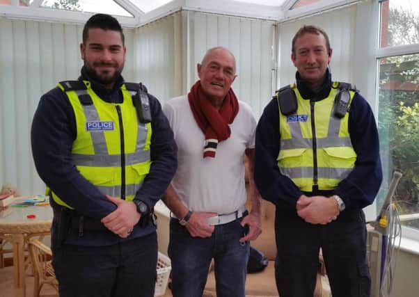 PCSOs Ryan White (left) and Dave Roberts (right) went to visit Brian Murphy, whose life they helped to save
