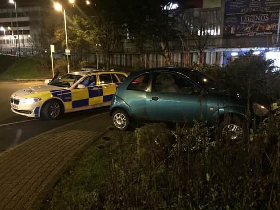 The Ford Ka was found lodged in a bush by police. Pic: @LancsRoadPolice