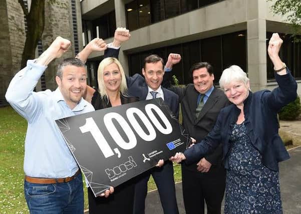 Coun Jennifer Mein, far right, with Phil Bevan, Kerry Lunt, Michael Forshaw and Andy Walker of Boost in a photograph taken when Boost helped its 1,000th buisness