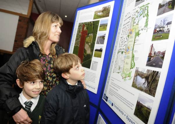 Developer Story Homes hold an exhibiton over plans for new homes in Wrea Green.  Beverley Jinks with Matthew and Daniel Jinks.