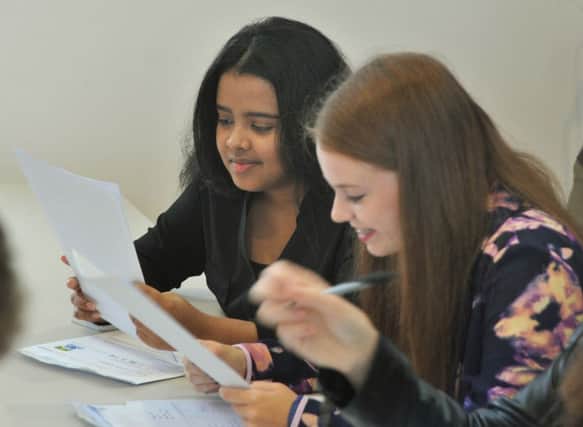 GCSE results day at St Mary's Catholic College in Blackpool.
Checking their results. PIC BY ROB LOCK
20-8-2015