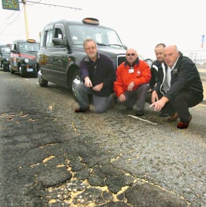 Blackpool taxi drivers highlight one of the potholes on the promenade. From left, Frank Landini, Steve Buckley, Bill Lewtas and Laurence Hunt