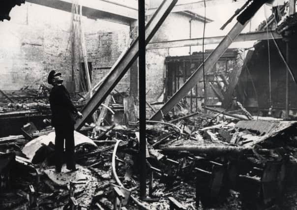Surveying the damage after the fire, at the Ashton Theatre, St Annes, in September 1977