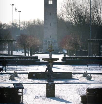 A snowy day in Blackpool's Stanley Park. Looking across the Italian Gardens to the clock tower