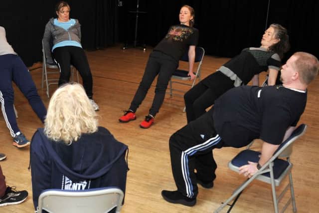 Poulton Drama take part in a movement workshop with a coach from the Royal Shakespeare Company