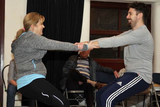 Cathy Lloyd and Huw Rose from Poulton Drama in the movement workshop with a coach from the Royal Shakespeare Company