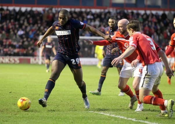 Blackpool's Uche Ikpeazu takes on Walsall's James O'Connor and Andy Taylor