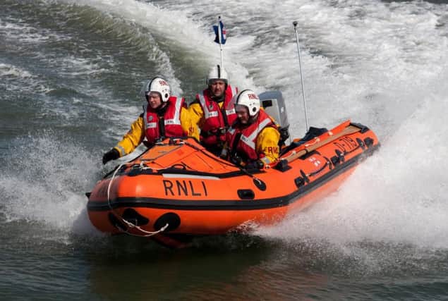 A stock image of RNLI volunteers in action