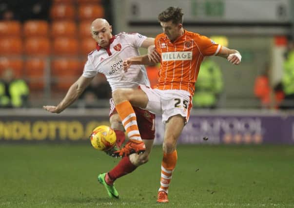 Blackpool's Will Aimson battles with Sheffield United's Conor Sammon