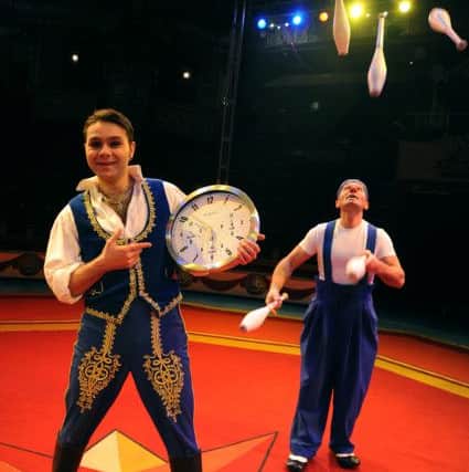 Blackpool Tower Circus clowns Mooky and Mr Boo attempted to break the world juggling record by passing six clubs between them 120 times in two minutes.
Mooky (right) and Mr Boo during the attempt.  PIC BY ROB LOCK
17-4-2014