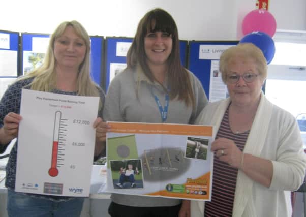 From left: Pat Greaves, treasurer of the Friends of the Memorial Park), Kate Baird (Memorial Park Duty Officer) and Ella Fletcher (Friends member) with plans of new swings for the park.