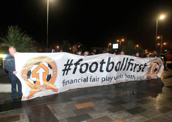 Blackpool fans stage a demonstration outside the Bloomfield Road before Tuesday's game