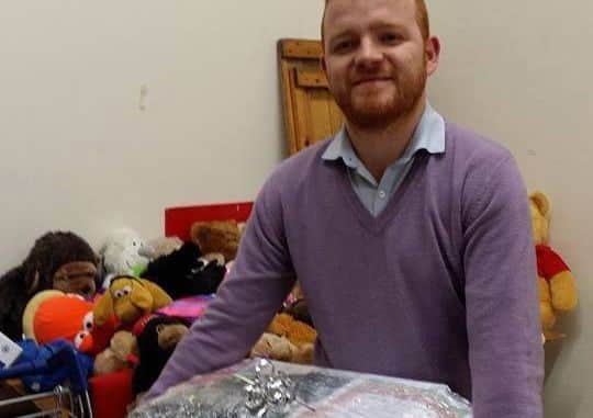 Coun Luke Taylor gets involved at a Care and Share swap shop