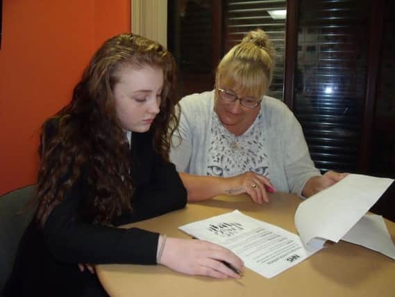 Rosie Wood, 14, and her nan Val Sweeney working together on the Blackpool Boys and Girls Clubs mental health questionnaire