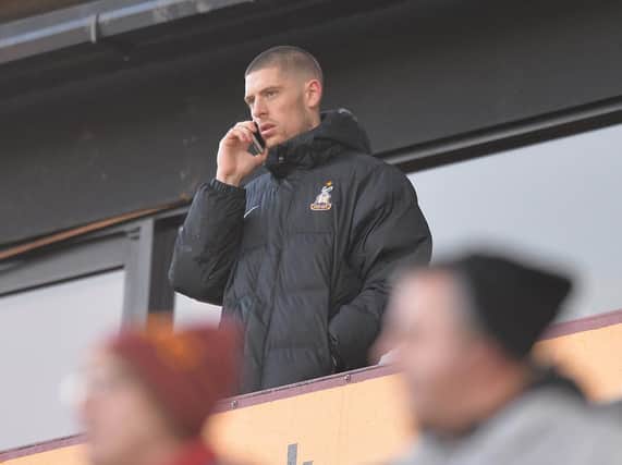 Jamie Proctor watches Saturday's game from the stands