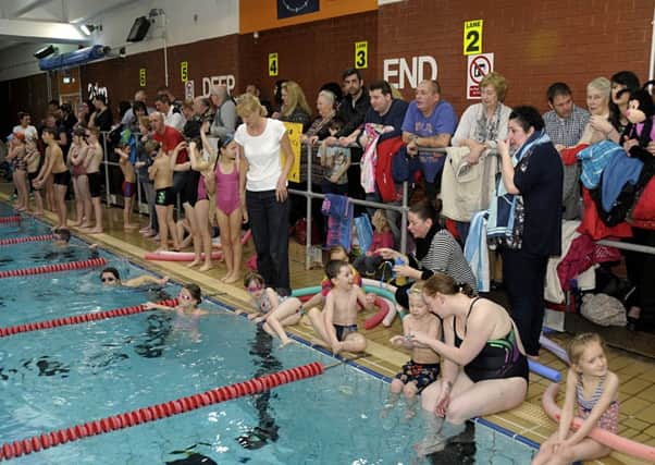 Parents and supporters cheer on the teams at the LSA Lions swimarathon