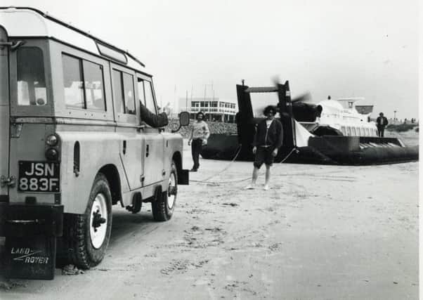Landrover stuck on the beach being pulled by Hovercraft May 1973