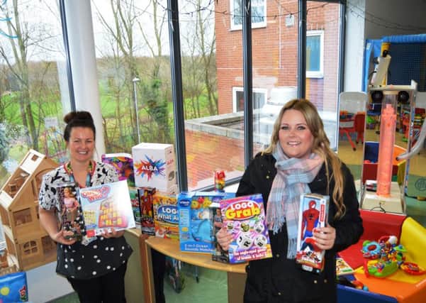 Geraldine Faber and Rosanne Norman with the donated toys