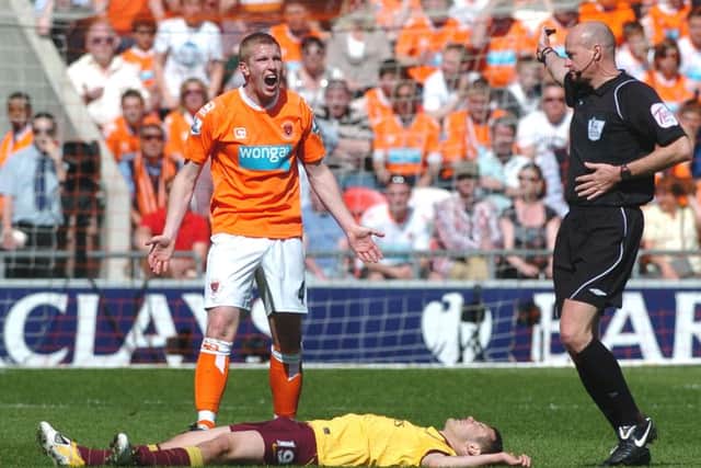 Keith Southern leaves Arsenal's Jack Wilshere flat out during Blackpool's Premier League season