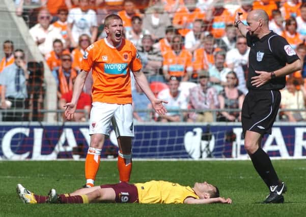 Keith Southern leaves Arsenal's Jack Wilshere flat out during Blackpool's Premier League season