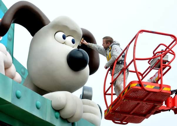 Mick Bradley gives Gromit a fresh lick of paint at Blackpool Pleasure Beach