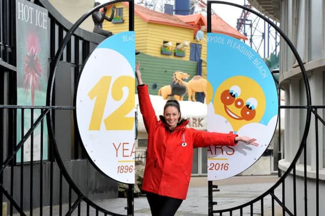 Judi Miles shows off the Pleasure Beach's new logo to mark the 120th anniversary year, as it prepares to open for the new season