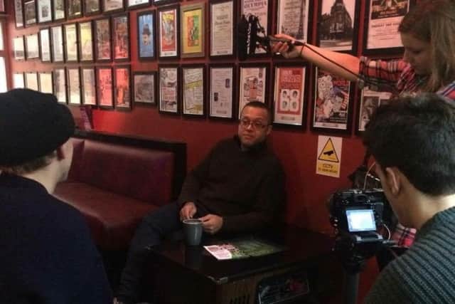 Stephen Pierre, owner of the Galleon Bar, chats to Bournemouth University media students
